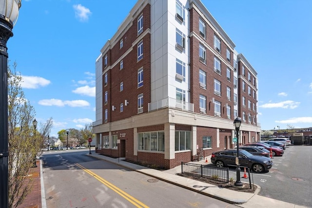 view of property with uncovered parking