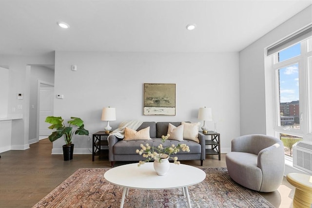 living room featuring recessed lighting, wood finished floors, and baseboards