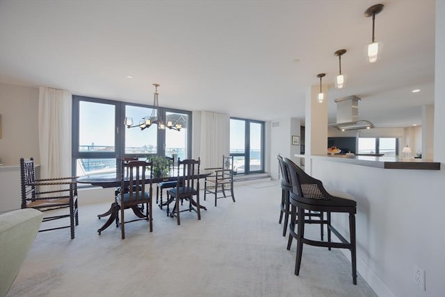 2001 Marina Dr Unit 707, Quincy, MA 02171 - dining space with a chandelier and light carpet