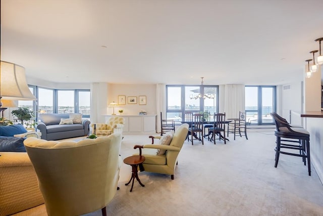 2001 Marina Dr Unit 707, Quincy, MA 02171 - living room with light carpet, a chandelier, and expansive windows