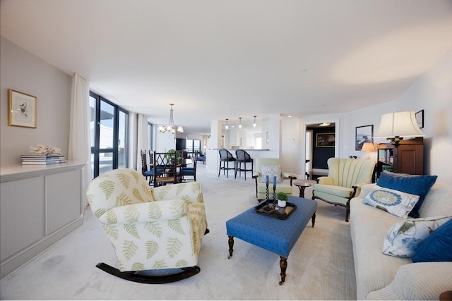 2001 Marina Dr Unit 707, Quincy, MA 02171 - living room featuring light colored carpet and a chandelier
