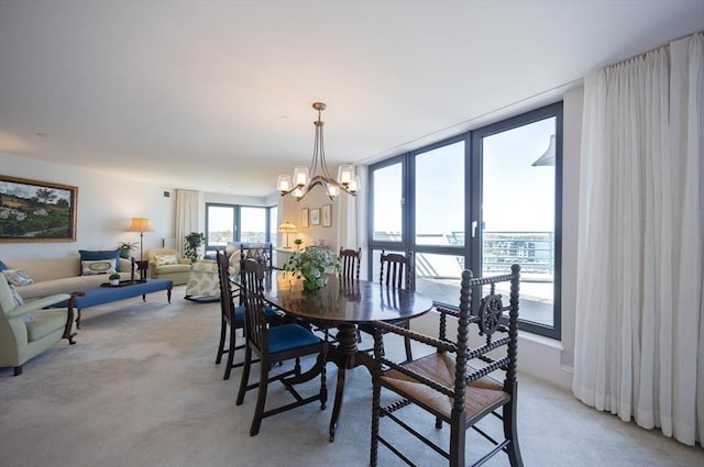 2001 Marina Dr Unit 707, Quincy, MA 02171 - dining area featuring light carpet and a chandelier