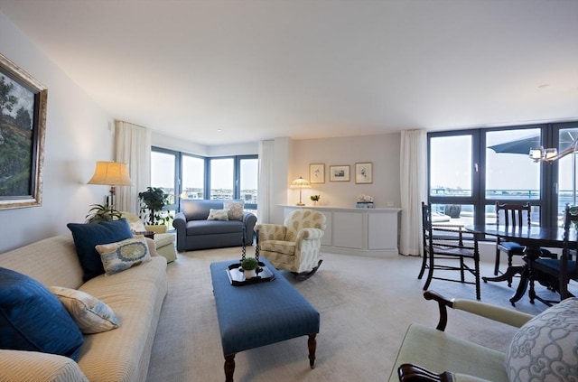 2001 Marina Dr Unit 707, Quincy, MA 02171 - living area featuring plenty of natural light, light carpet, and a chandelier