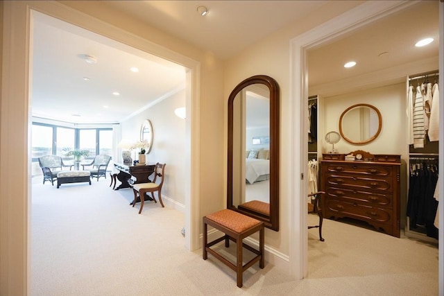 2001 Marina Dr Unit 707, Quincy, MA 02171 - hallway featuring light colored carpet, recessed lighting, crown molding, baseboards, and arched walkways