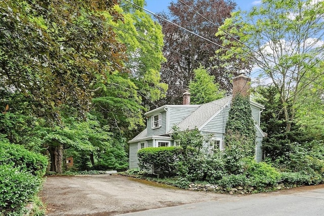 14 Upland Rd, Andover, MA 01810 - view of side of property featuring a chimney