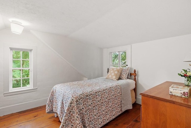 14 Upland Rd, Andover, MA 01810 - bedroom with hardwood / wood-style flooring, vaulted ceiling, and multiple windows