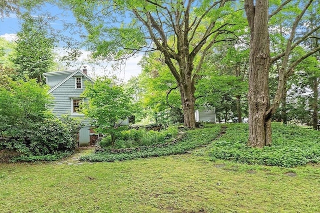 14 Upland Rd, Andover, MA 01810 - view of grassy yard featuring a storage unit