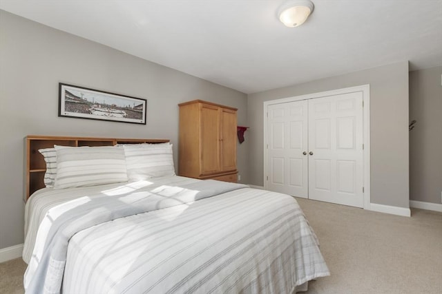 carpeted bedroom featuring a closet