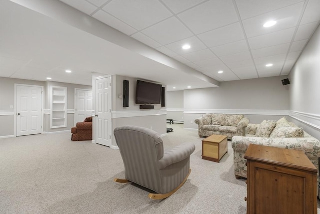 living room with light carpet and built in shelves