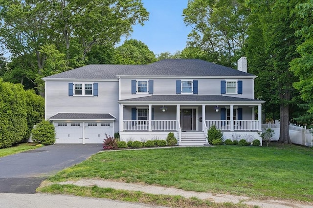 290 Lyman Rd, Milton, MA 02186 - view of front facade with driveway, a chimney, covered porch, a garage, and a shingled roof