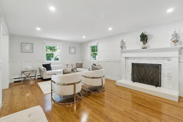 290 Lyman Rd, Milton, MA 02186 - living area featuring ornamental molding, a wainscoted wall, a decorative wall, wood finished floors, and recessed lighting