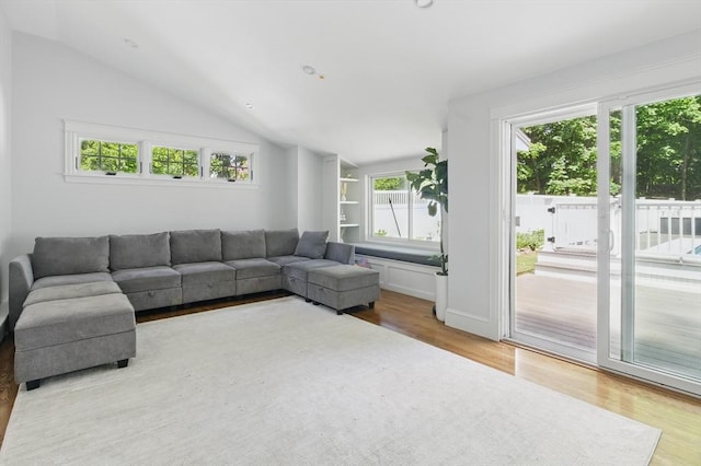 290 Lyman Rd, Milton, MA 02186 - living area featuring light wood-style flooring, healthy amount of natural light, and vaulted ceiling