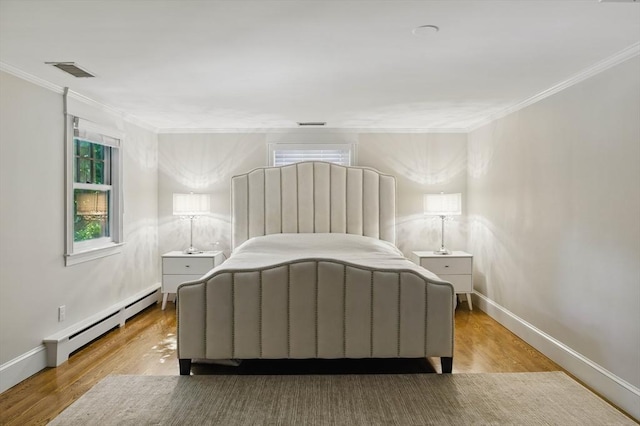 290 Lyman Rd, Milton, MA 02186 - bedroom featuring baseboard heating, crown molding, wood finished floors, baseboards, and multiple windows