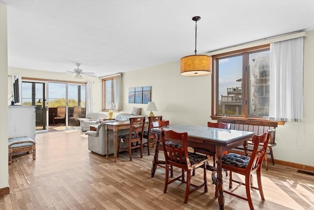 492 N End Blvd, Salisbury, MA 01952 - dining room featuring wood finished floors and ceiling fan