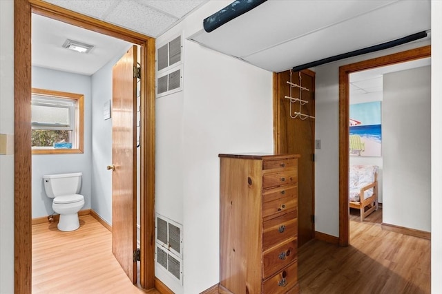 492 N End Blvd, Salisbury, MA 01952 - corridor featuring wood finished floors and a heating unit