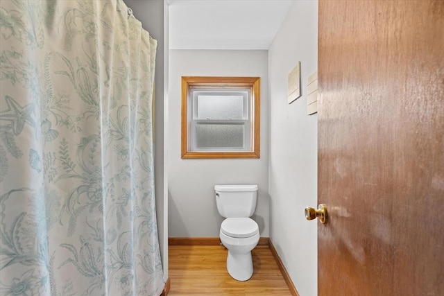 492 N End Blvd, Salisbury, MA 01952 - bathroom with wood finished floors and a shower with shower curtain