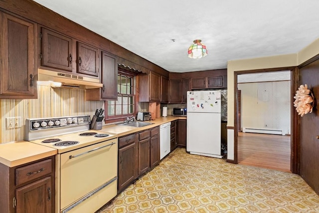 kitchen featuring baseboard heating, a sink, white appliances, light countertops, and under cabinet range hood