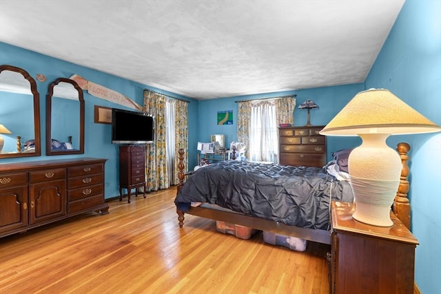 bedroom with wood finished floors