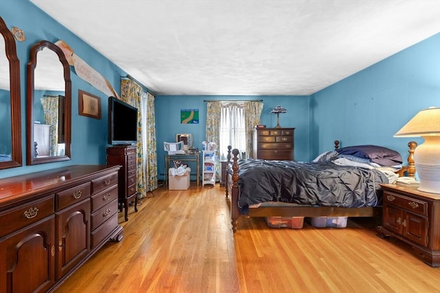 bedroom with light wood-style floors