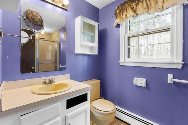 full bath featuring vanity, a shower stall, a baseboard radiator, and toilet