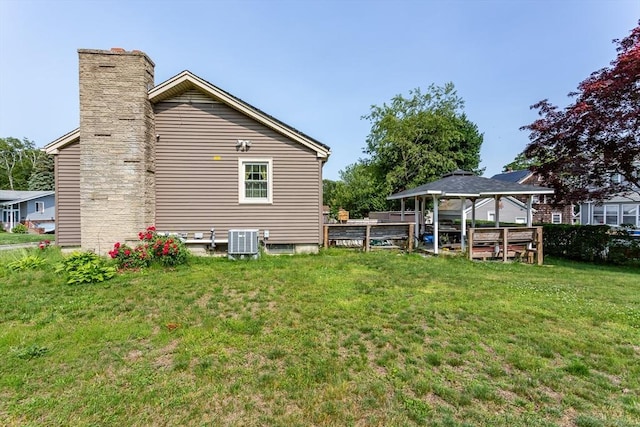 101 Primrose St, Fall River, MA 02720 - view of side of property with a lawn, a gazebo, and a chimney