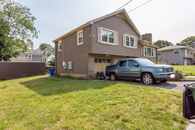 101 Primrose St, Fall River, MA 02720 - view of property exterior with a garage, driveway, a chimney, and a lawn