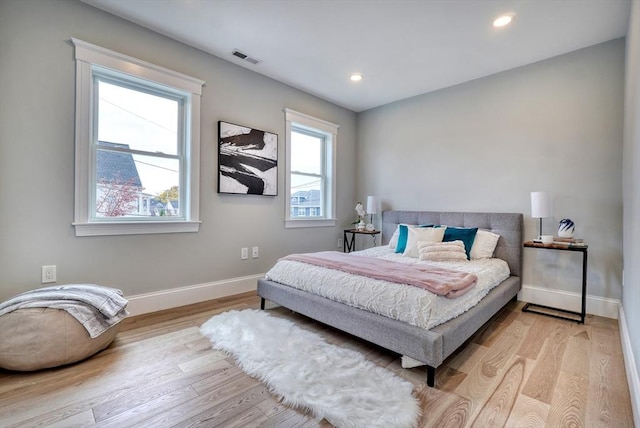 bedroom with light hardwood / wood-style flooring