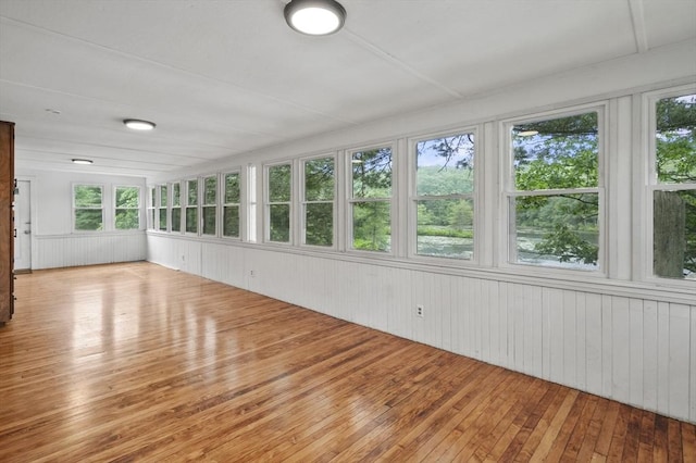 3 Cranberry Meadow Shore Rd, Charlton, MA 01507 - unfurnished sunroom with wood-type flooring, healthy amount of natural light, wood walls, and a deck