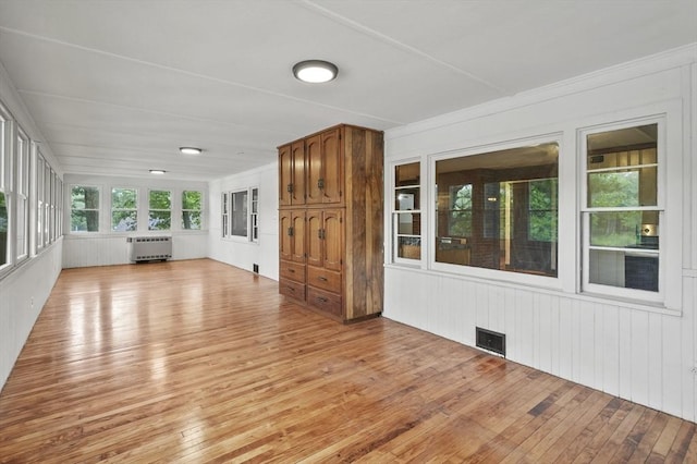 3 Cranberry Meadow Shore Rd, Charlton, MA 01507 - unfurnished living room with radiator and light wood-style flooring