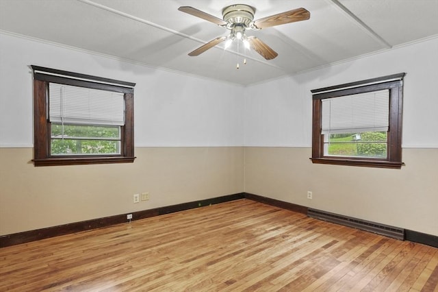 3 Cranberry Meadow Shore Rd, Charlton, MA 01507 - empty room with baseboard heating, plenty of natural light, light wood finished floors, a ceiling fan, and ornamental molding
