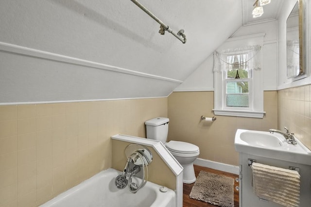 3 Cranberry Meadow Shore Rd, Charlton, MA 01507 - full bathroom with tile walls, a bath, wood finished floors, lofted ceiling, and vanity