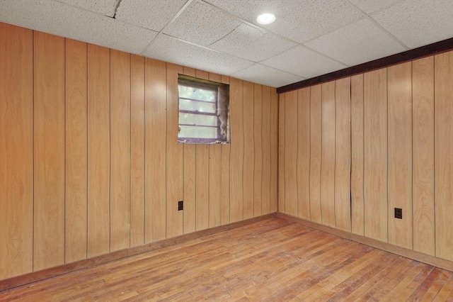 3 Cranberry Meadow Shore Rd, Charlton, MA 01507 - spare room with hardwood / wood-style floors, wood walls, and a drop ceiling