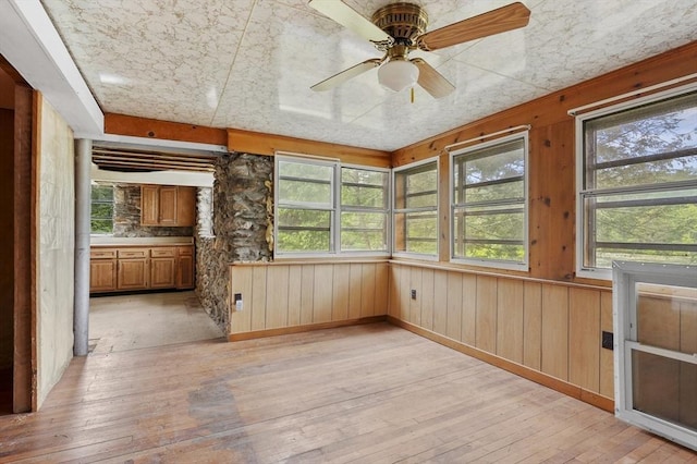 3 Cranberry Meadow Shore Rd, Charlton, MA 01507 - unfurnished sunroom featuring plenty of natural light, wood-type flooring, wood walls, and a wooden deck