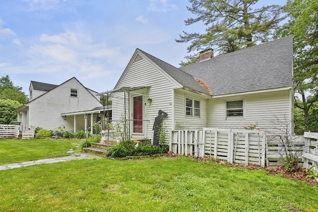 3 Cranberry Meadow Shore Rd, Charlton, MA 01507 - view of front of house featuring a chimney, a front yard, and roof with shingles