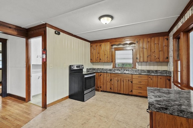 3 Cranberry Meadow Shore Rd, Charlton, MA 01507 - kitchen featuring electric range oven, brown cabinets, and wood walls