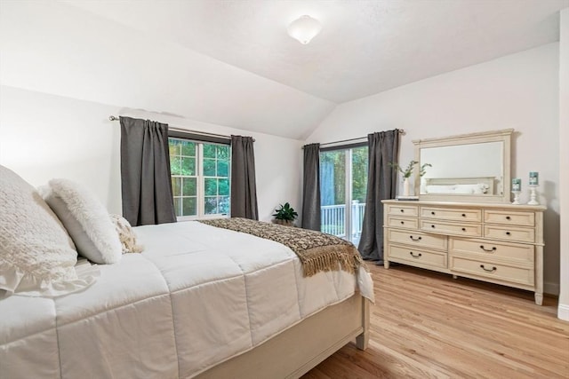74 Hidden Bay Dr Unit 74, Dartmouth, MA 02748 - bedroom with access to outside, multiple windows, lofted ceiling, and light wood-type flooring