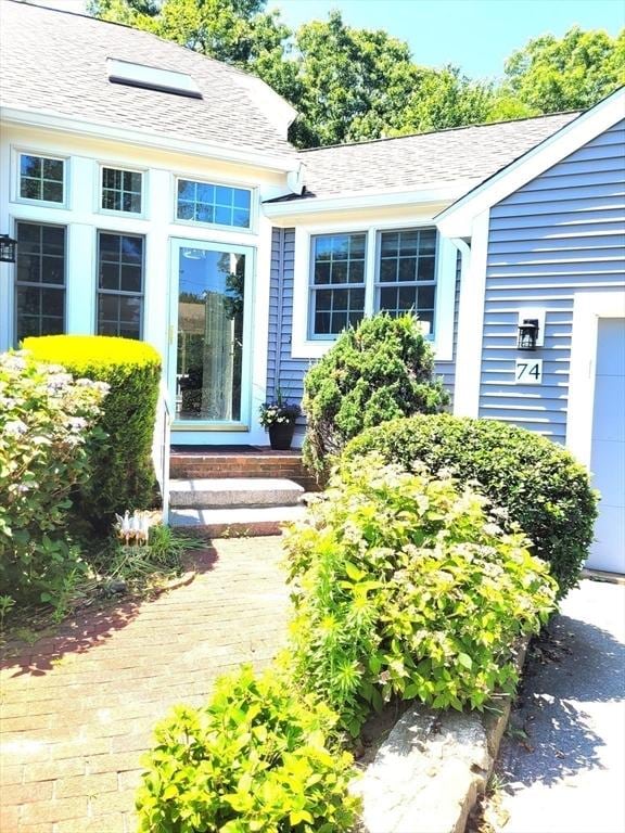 74 Hidden Bay Dr Unit 74, Dartmouth, MA 02748 - doorway to property featuring a shingled roof