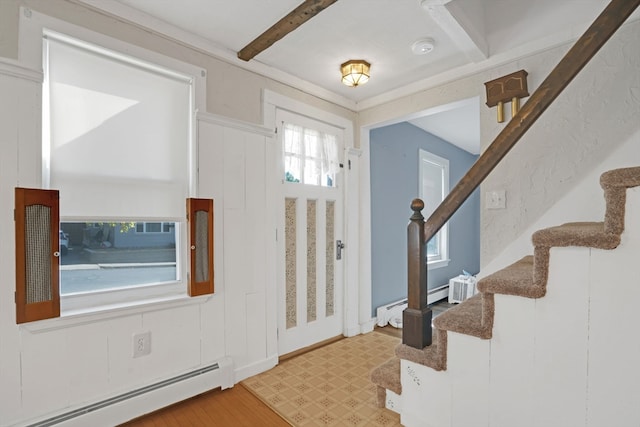 foyer entrance with beam ceiling, light hardwood / wood-style flooring, and a baseboard radiator