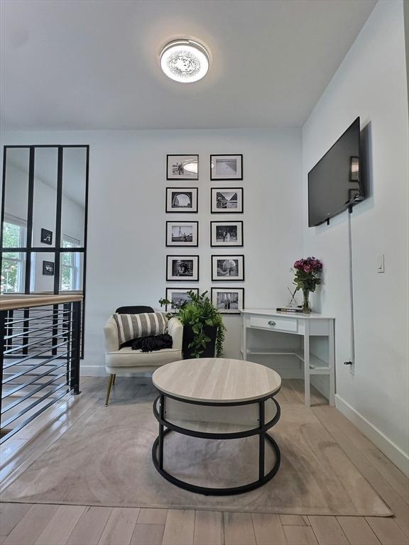 187 London St Unit 1, Boston, MA 02128 - sitting room with baseboards
