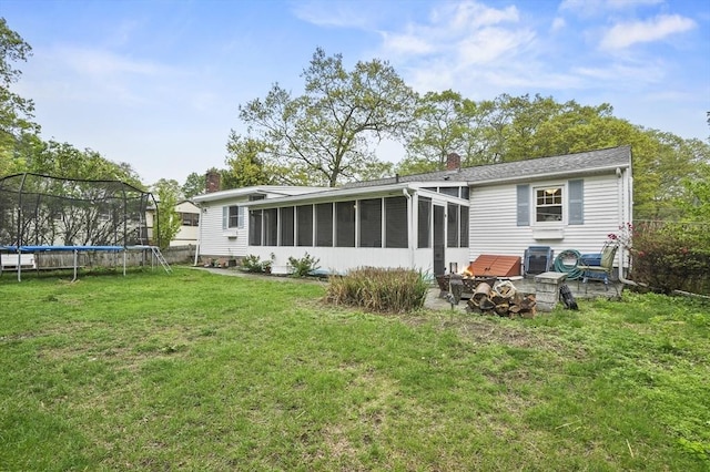 6 Batten St, Webster, MA 01570 - back of house with a trampoline, a sunroom, and a chimney