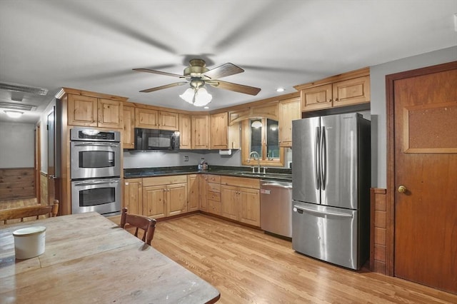 6 Batten St, Webster, MA 01570 - kitchen with appliances with stainless steel finishes, a sink, a ceiling fan, light wood finished floors, and dark countertops