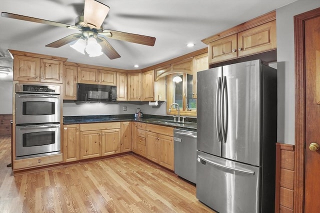 6 Batten St, Webster, MA 01570 - kitchen with stainless steel appliances, a sink, dark countertops, light wood-style floors, and recessed lighting