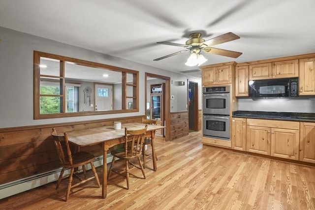 6 Batten St, Webster, MA 01570 - kitchen featuring black microwave, double oven, baseboard heating, dark countertops, and light wood finished floors
