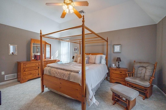 bedroom featuring lofted ceiling, carpet flooring, and visible vents