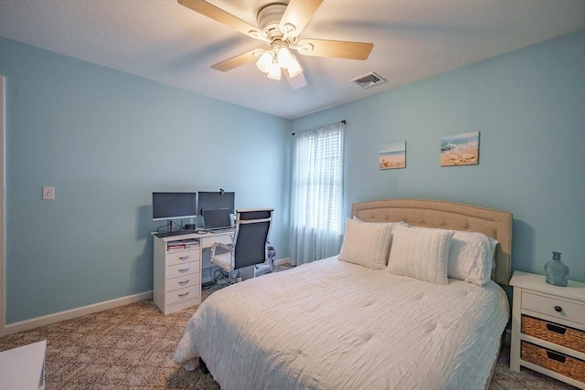 bedroom featuring visible vents, carpet floors, baseboards, and ceiling fan