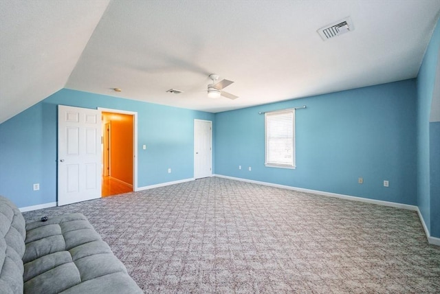 unfurnished living room with a ceiling fan, baseboards, visible vents, and carpet floors