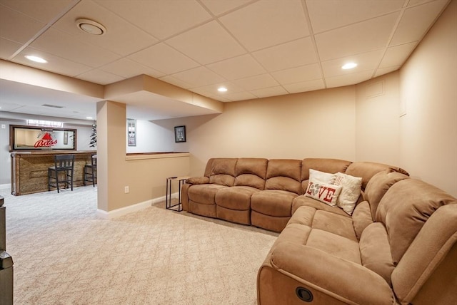 living room with recessed lighting, baseboards, carpet floors, and a paneled ceiling