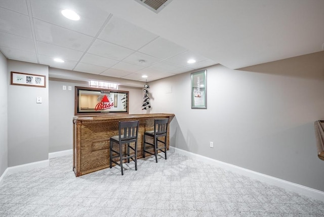 bar with baseboards, carpet floors, and a dry bar