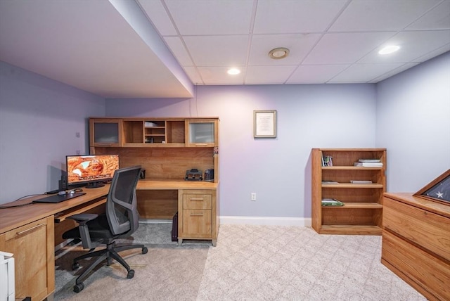 office space with recessed lighting, light colored carpet, baseboards, and a drop ceiling