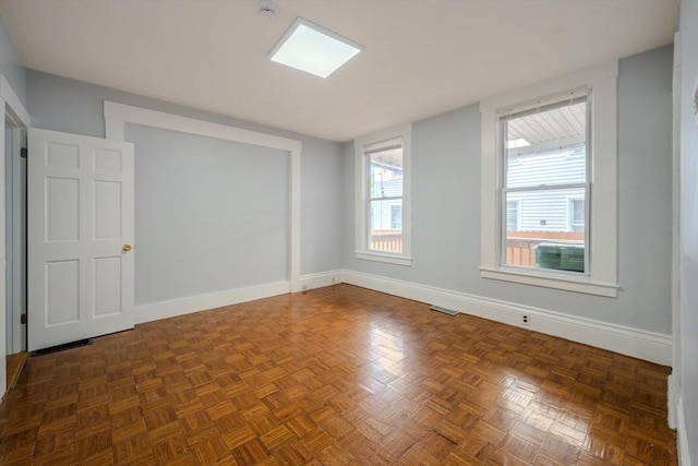 36 3rd St, Lowell, MA 01850 - spare room with baseboards and a smoke detector